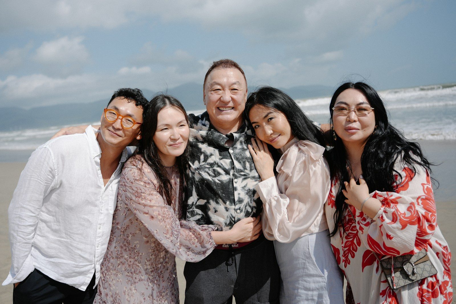 A happy family posing on a beach, family therapist in Carlsbad ca San Diego ca
